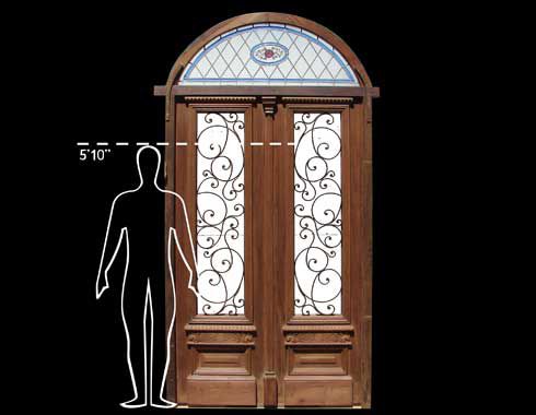 Double arched entrance door with stained glass and wrought iron insert 