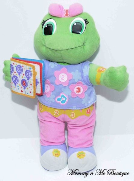   lily plush doll teaches child how to count in both spanish and english