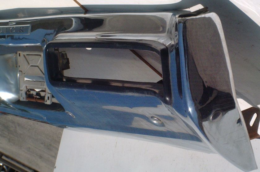 This is an original rear bumper, emblem, brackets, rubber trim for a 