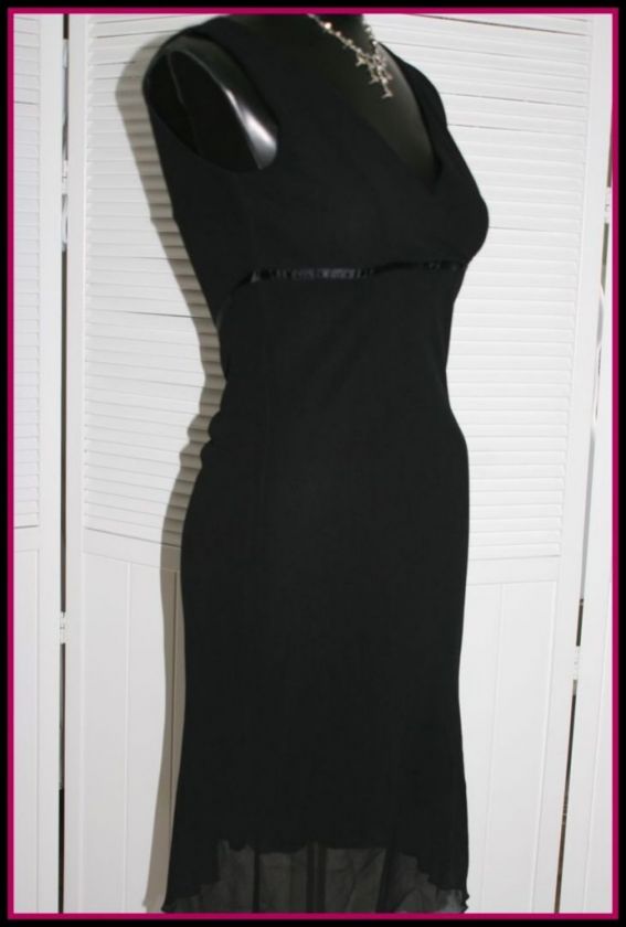   Empire waistline flares to hemline. Fully lined, no buttons or zips